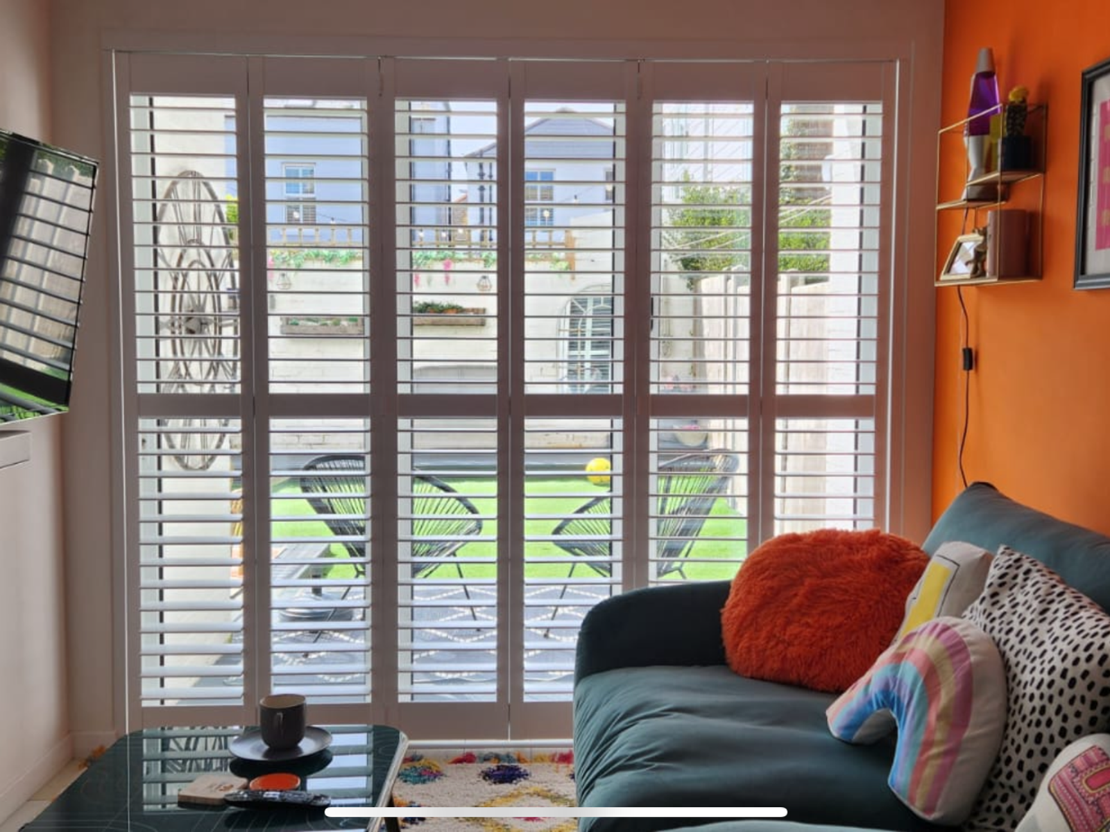 Full height plantation shutters in a living room