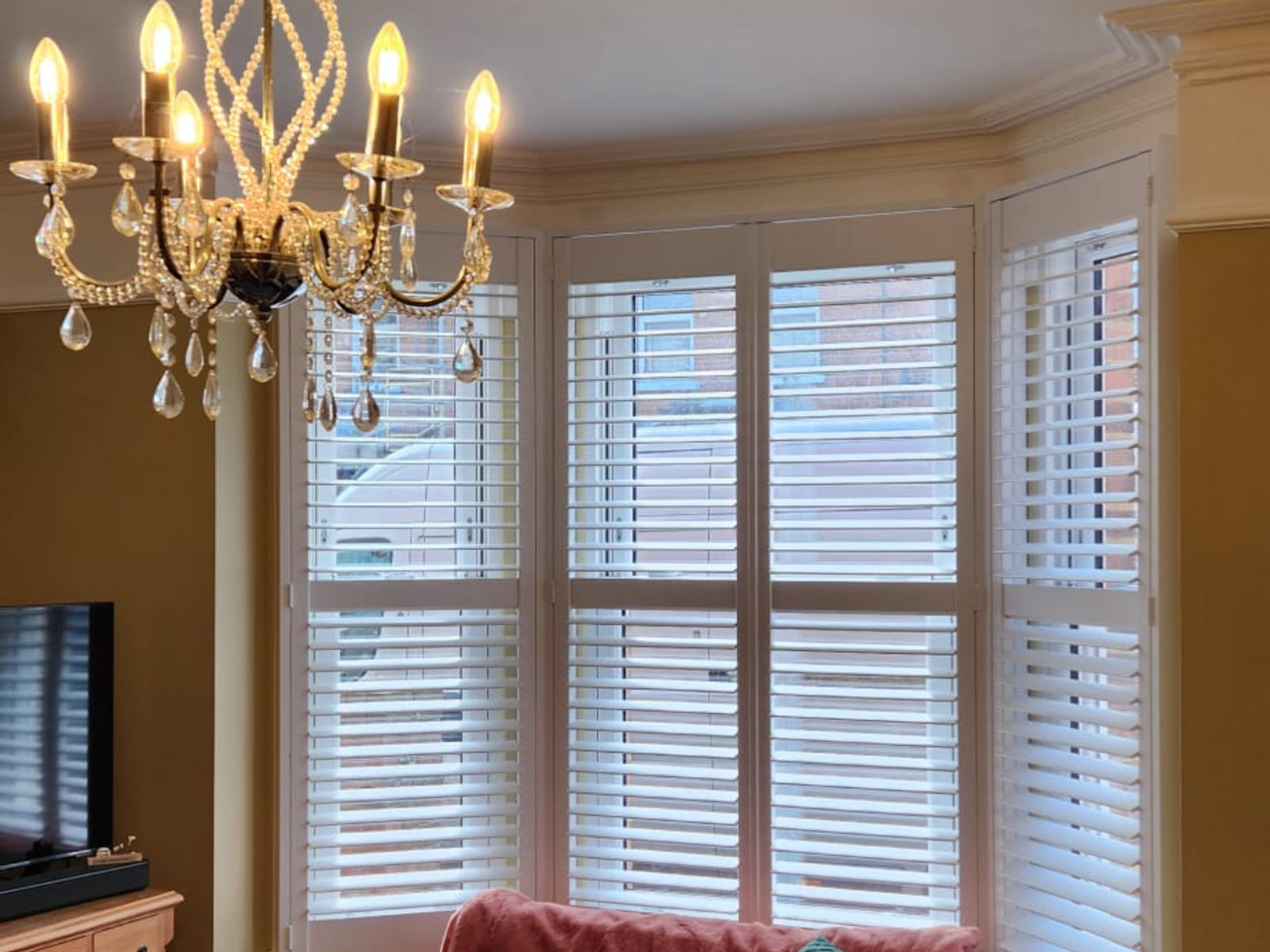 Plantation shutters across a bay window