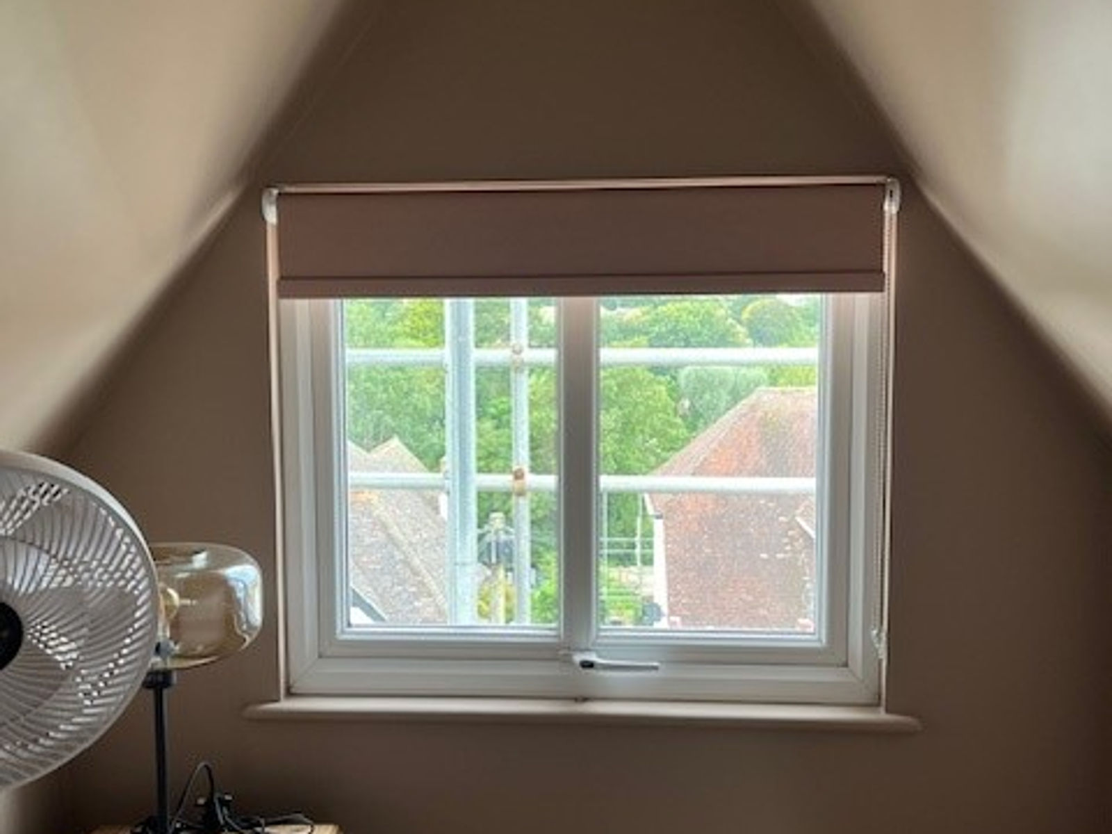 Blackout roller blind in a loft bedroom