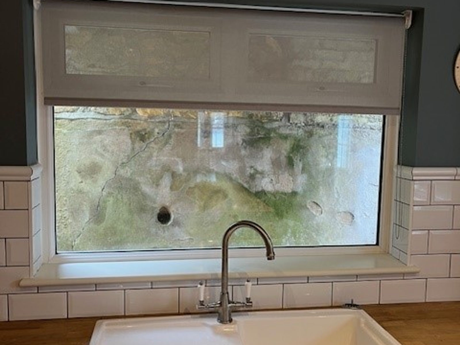 Voile roller blind over a kitchen sink